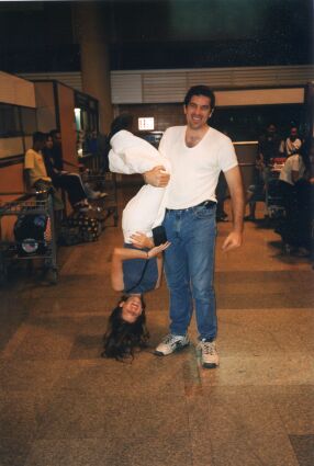 Me getting turned upside down by my brother in the airport at Thailand